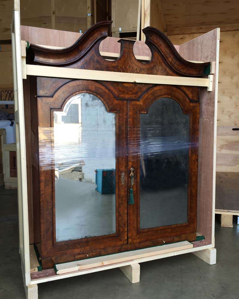 An antique cabinet packed securely for removal