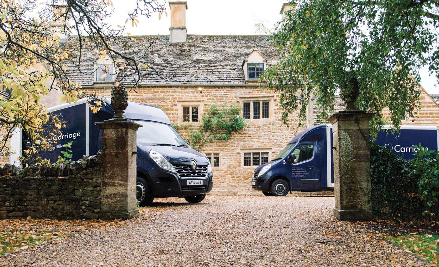 Two House and Carriage vans outside a property in the Cotswolds